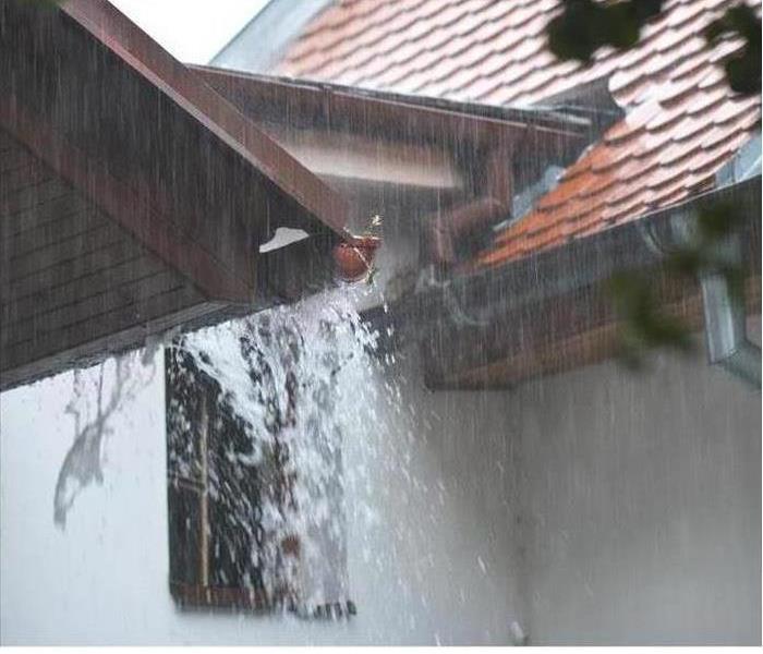 Gutters overflowing with water 
